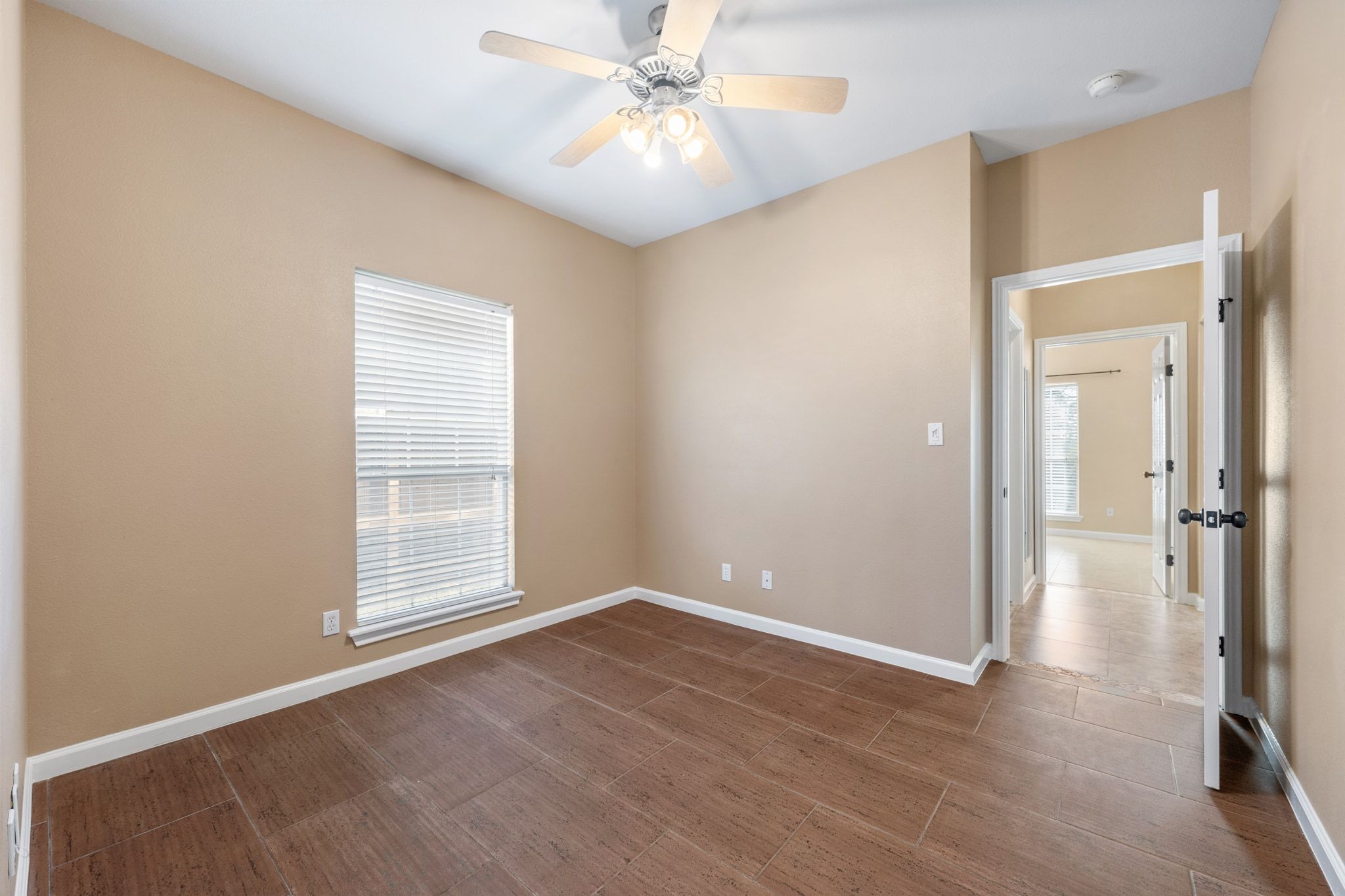 3139 Chisholm Trail Austin, TX 78734 - Photo 27 of 37 Spare room featuring baseboards and a ceiling fan