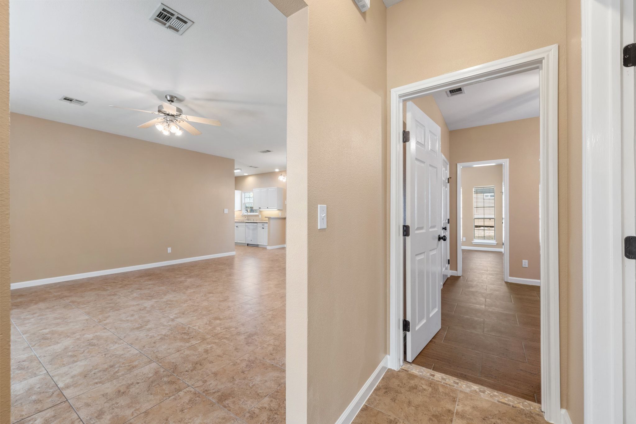 3139 Chisholm Trail Austin, TX 78734 - Photo 31 of 37 Corridor featuring light tile patterned floors and baseboards
