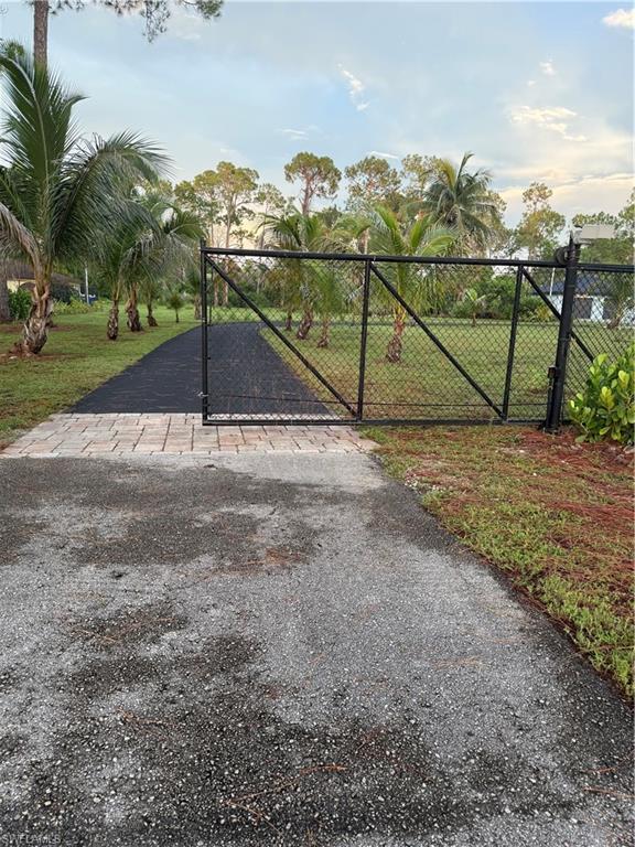 Gated Entry provides access to vacant lot
