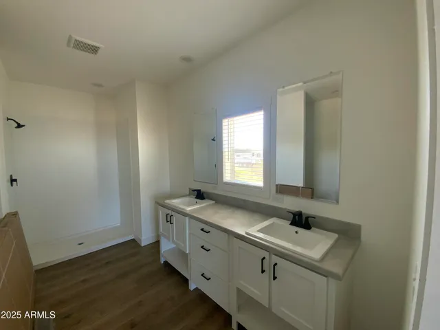 a bathroom with a sink and a window