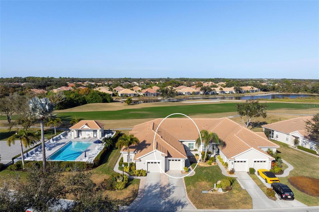 649 Back 9 Drive Venice, FL 34285 - Photo 1 of 1 an aerial view of a house with a lake view
