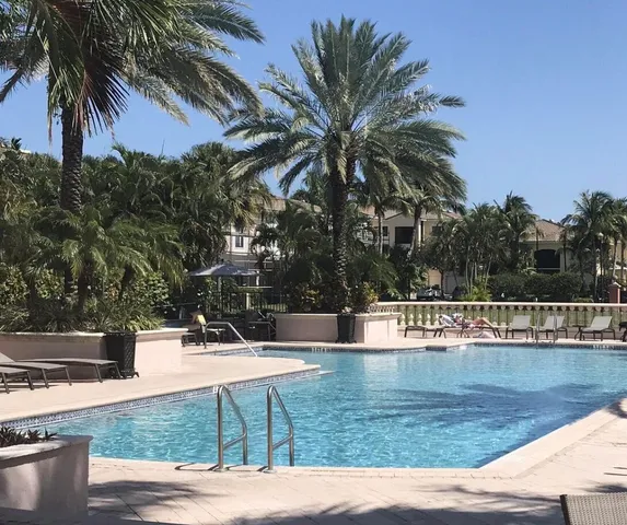 a view of swimming pool with chairs