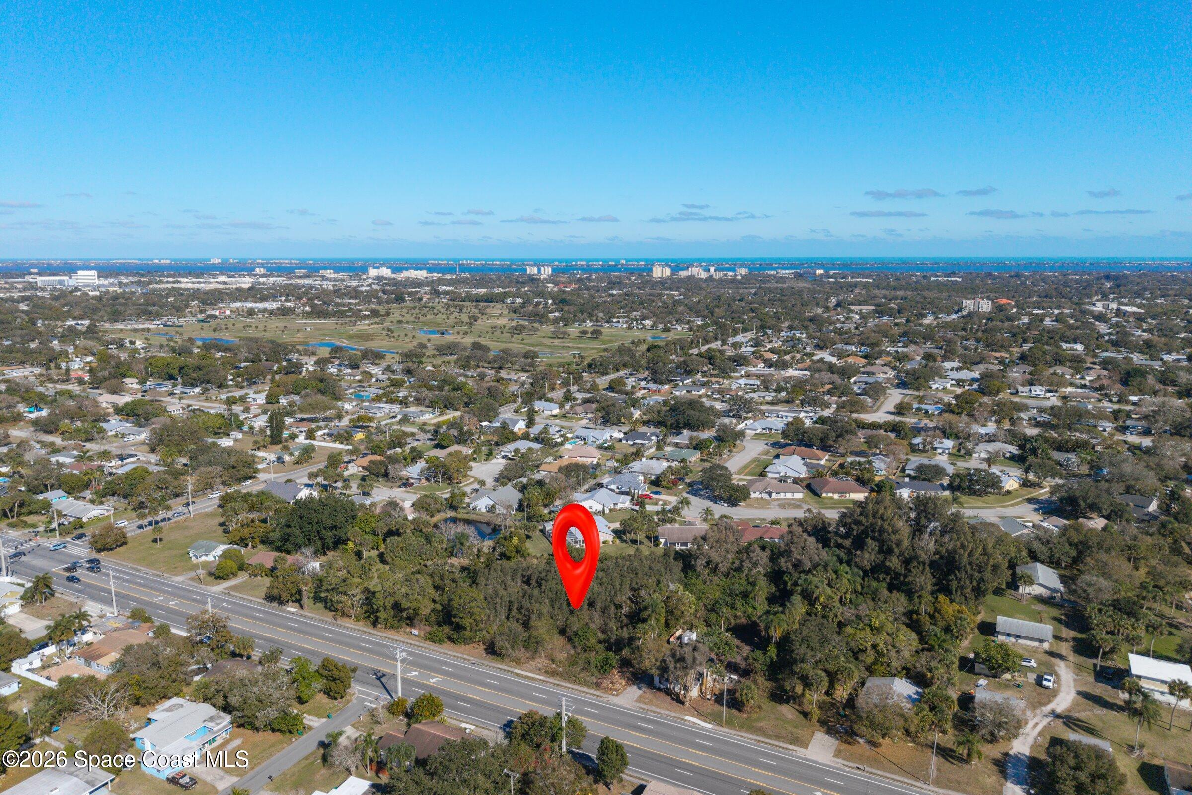 2561 Dairy Road Melbourne, FL 32904 - Photo 4 of 8 an aerial view of a city