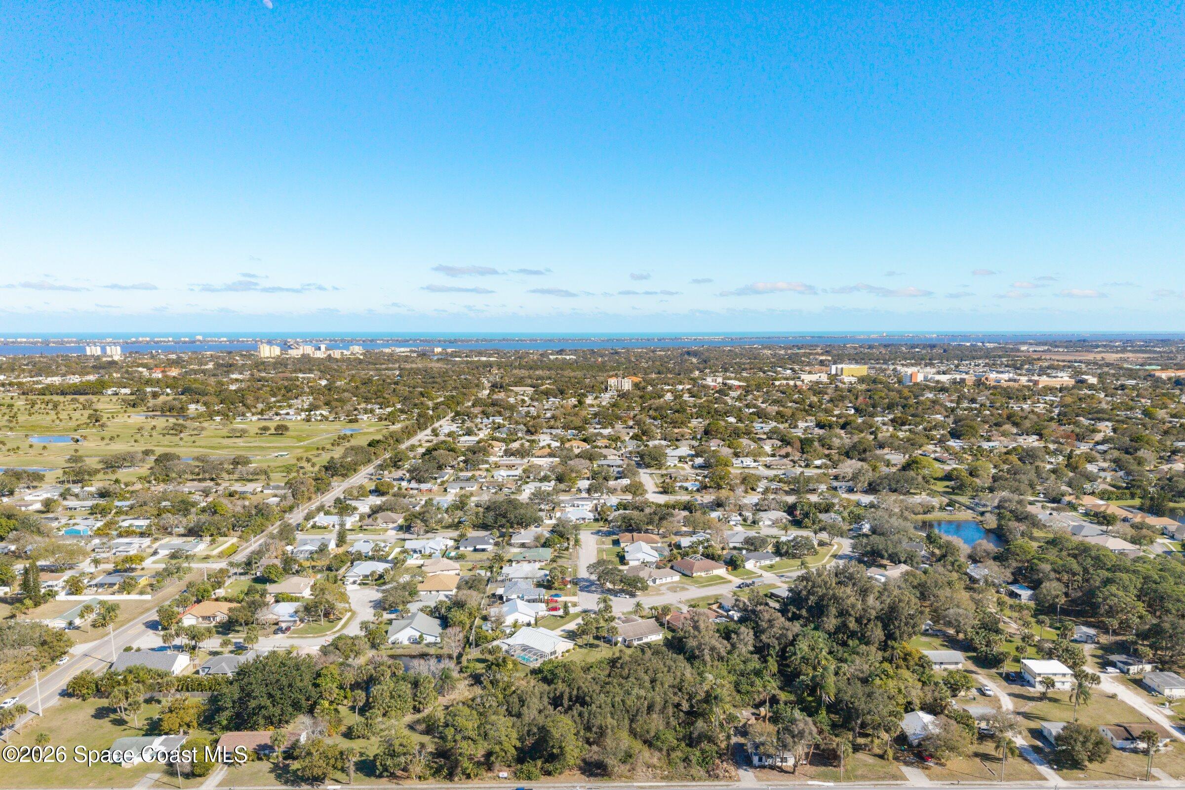 2561 Dairy Road Melbourne, FL 32904 - Photo 7 of 8 an aerial view of residential space with city view