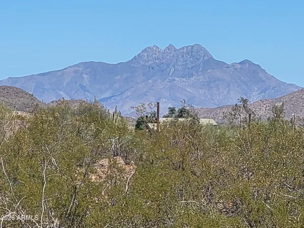 a view of a house with a mountain and a mountain view