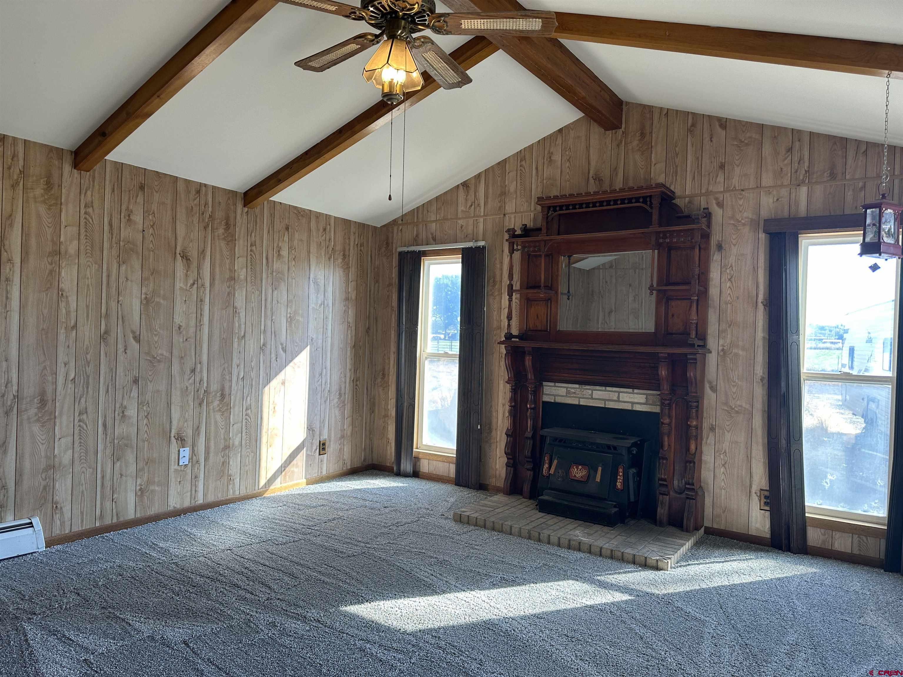 1090 Cloverleaf Lane Delta, CO 81416 - Photo 2 of 30 a view of an empty room with a fireplace and a window