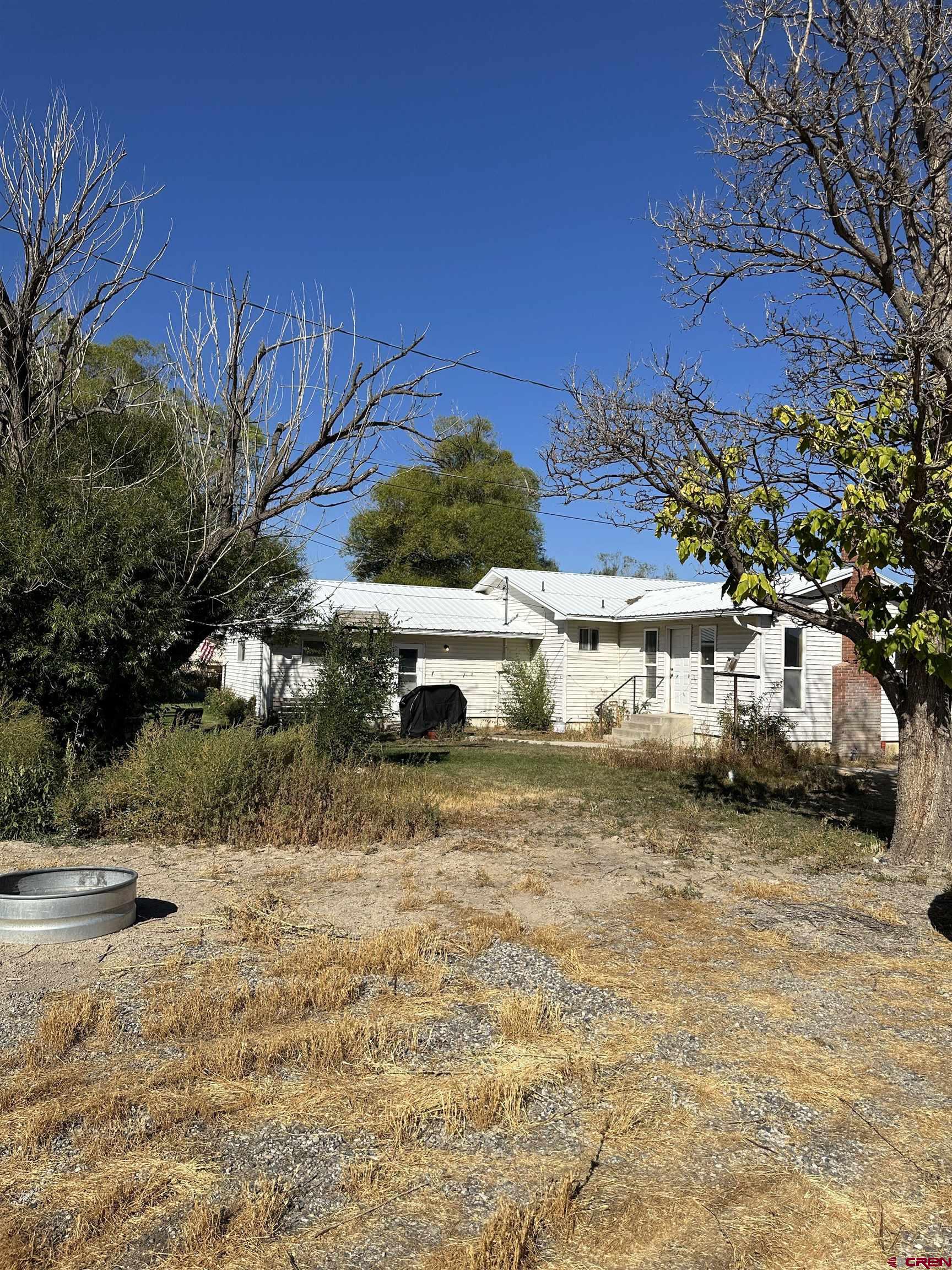 1090 Cloverleaf Lane Delta, CO 81416 - Photo 24 of 30 a view of a yard with cars