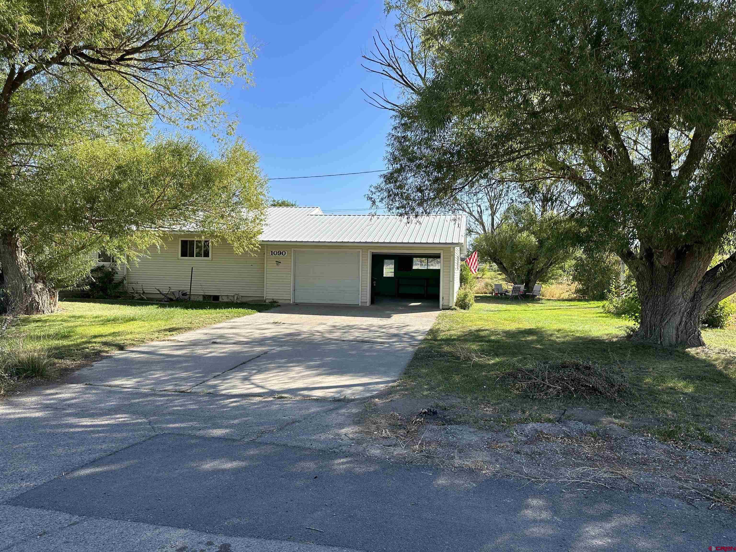 1090 Cloverleaf Lane Delta, CO 81416 - Photo 30 of 30 a view of a house with backyard and tree