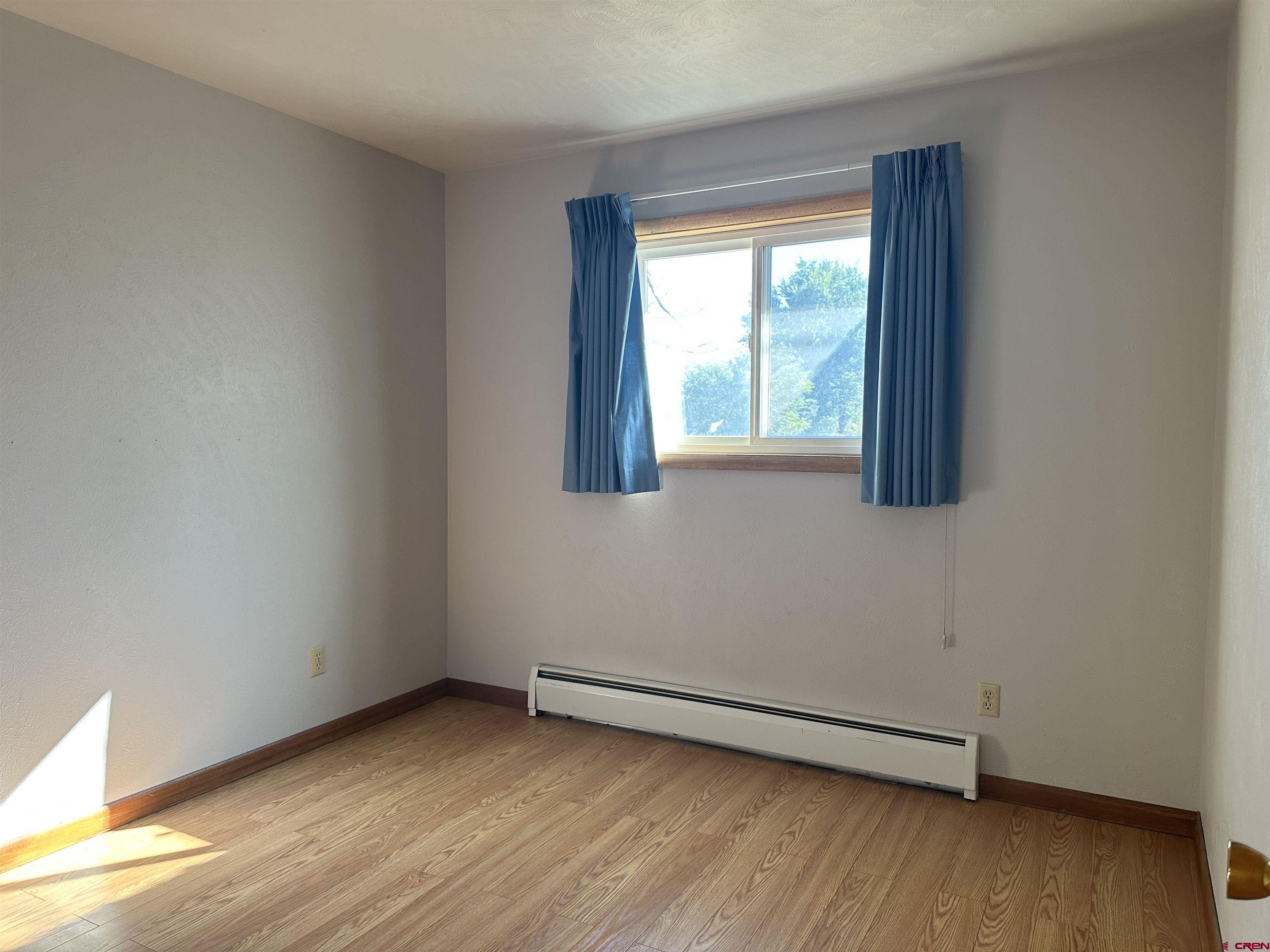 1090 Cloverleaf Lane Delta, CO 81416 - Photo 8 of 30 a view of a room with wooden floor and a window