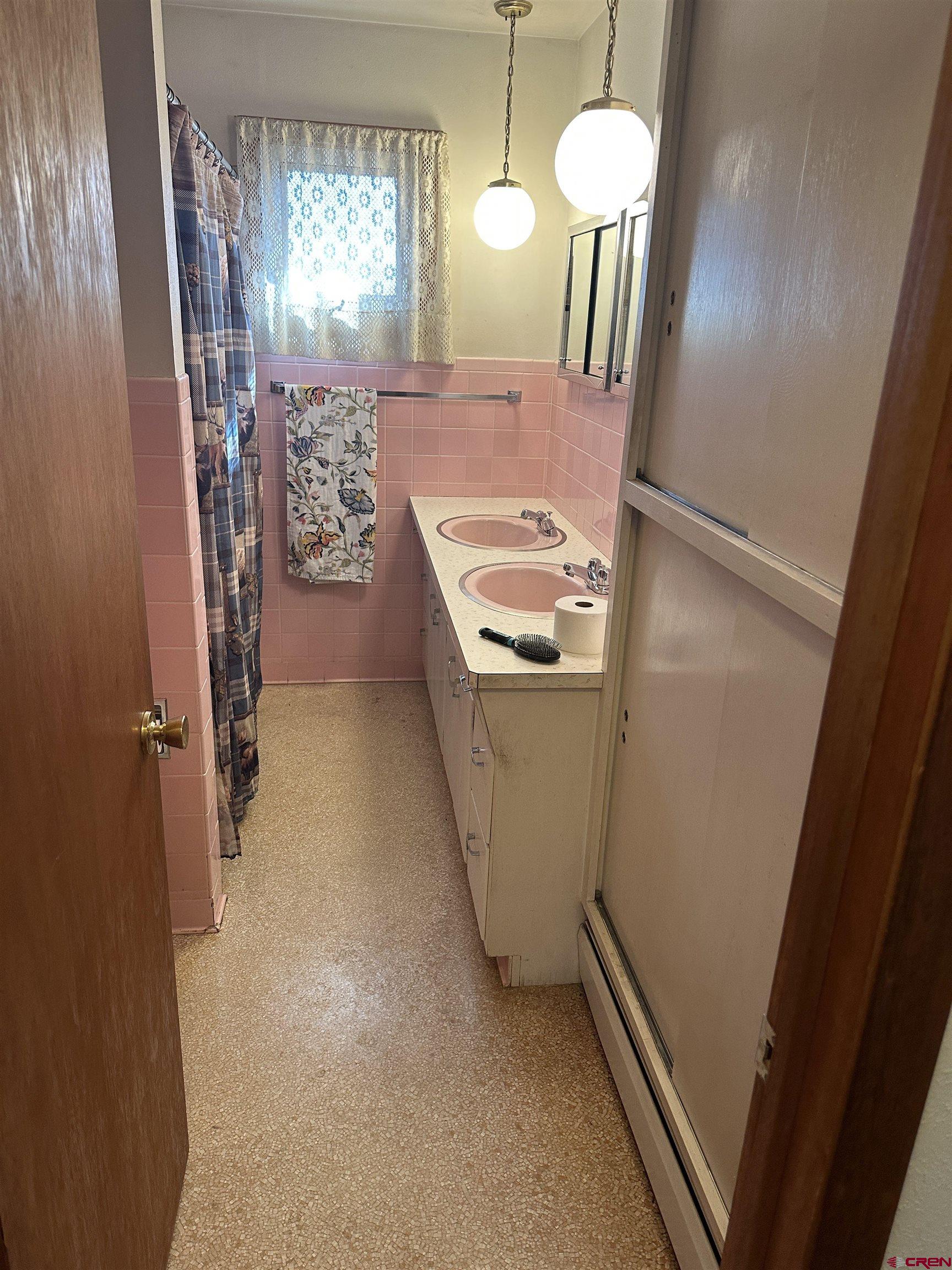 1090 Cloverleaf Lane Delta, CO 81416 - Photo 9 of 30 a view of a hallway with furniture and chandelier