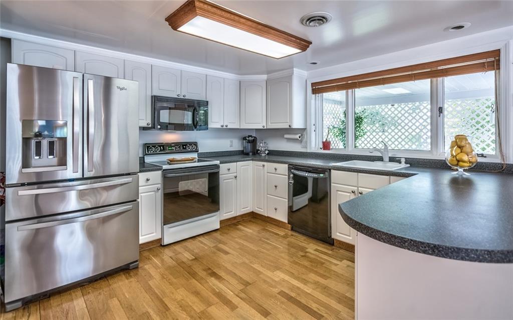 1524 Anderson Road Pittsburgh, PA 15209 - Photo 7 of 25 a kitchen with stainless steel appliances granite countertop a sink a stove and refrigerator