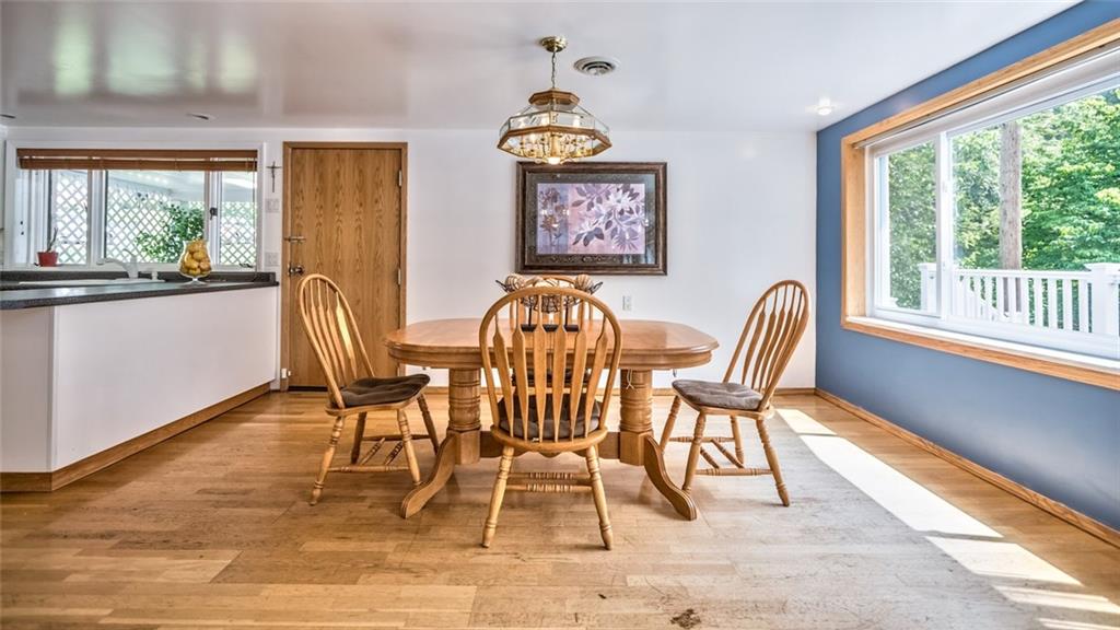 1524 Anderson Road Pittsburgh, PA 15209 - Photo 8 of 25 a view of a dining room with furniture a chandelier and wooden floor