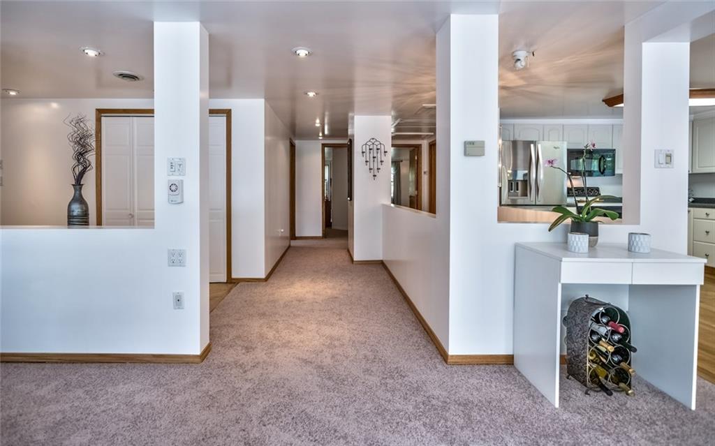 1524 Anderson Road Pittsburgh, PA 15209 - Photo 10 of 25 a view of a hallway with dining area and chandelier
