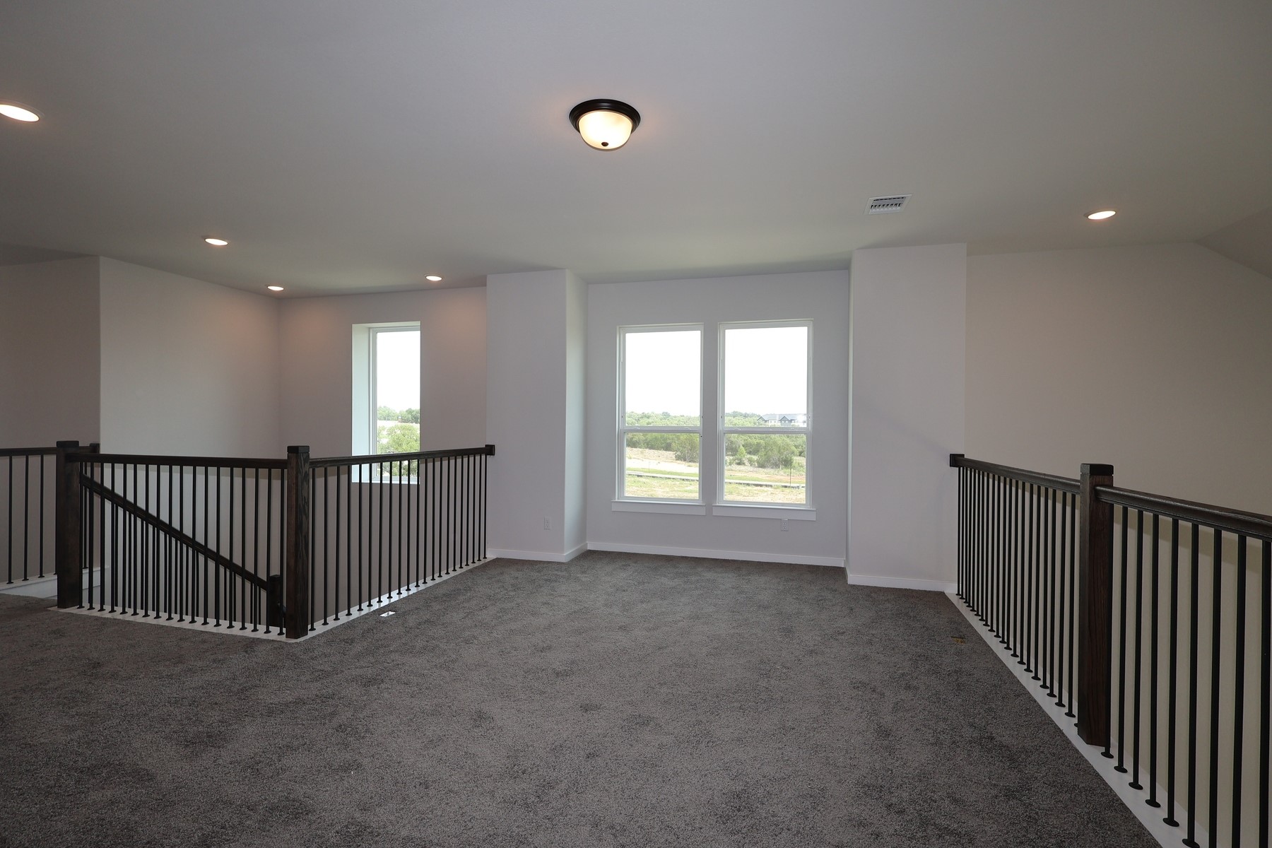 436 Leaning Rock Road Georgetown, TX 78628 - Photo 17 of 22 a view of a hallway with windows