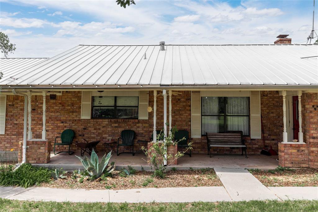 3718 Highway 36 Rising Star, TX 76471 - Photo 6 of 36 a front view of a house with garden