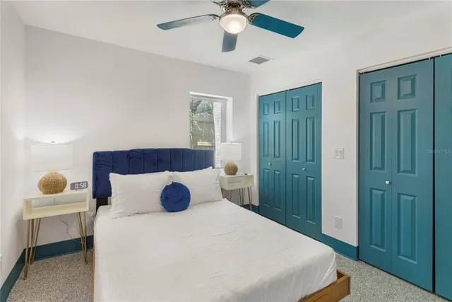 a bedroom with a bed and window