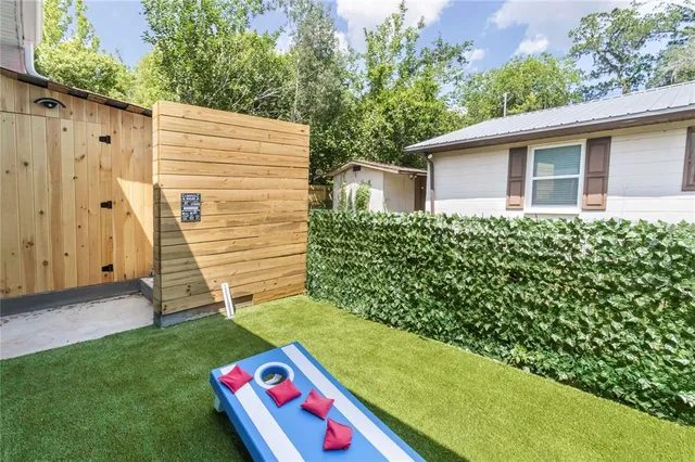 a back view of a house with a yard