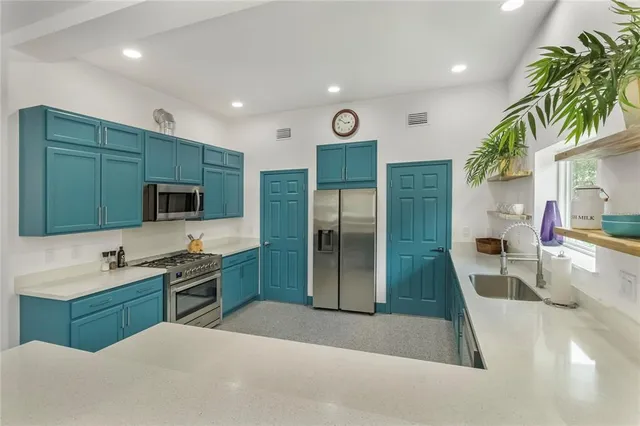 a large bathroom with a sink a large mirror and a shower