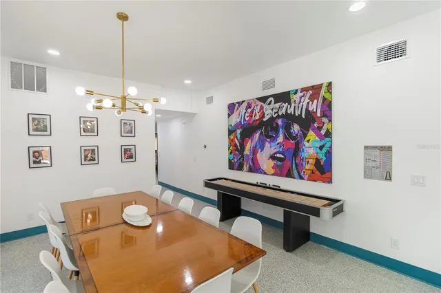 a view of a room with furniture and wooden floor