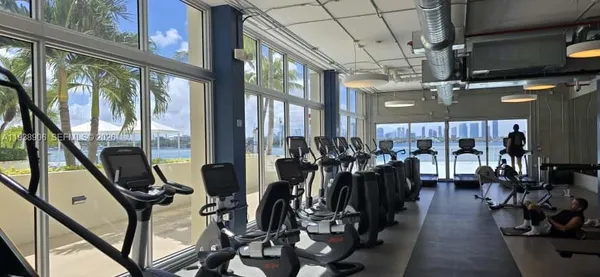 a view of a dining room with furniture and window