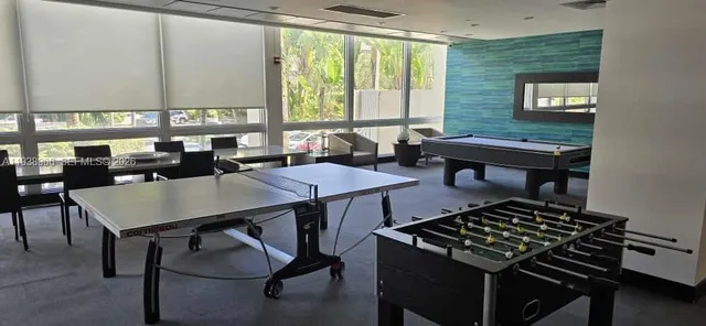 a kitchen with a refrigerator and a sink