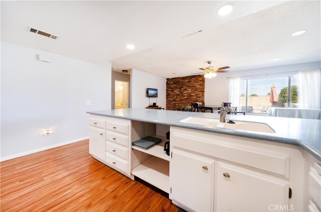 26398 Spaniel Lane Menifee, CA 92586 - Photo 16 of 39 a spacious bathroom with double vanity and a mirror