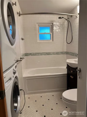 a bathroom with a toilet a sink and a shower