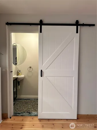 a bathroom with a sink and a mirror