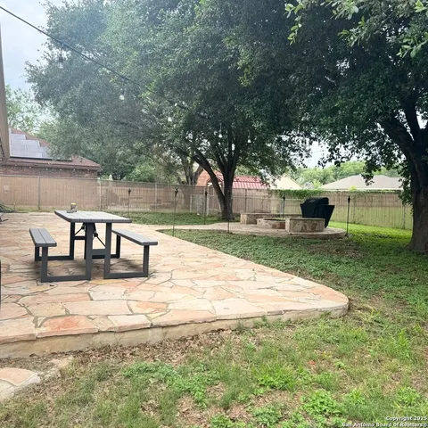 a view of a yard with an outdoor space