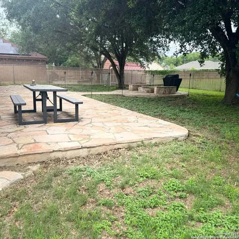 a view of a yard with an outdoor space