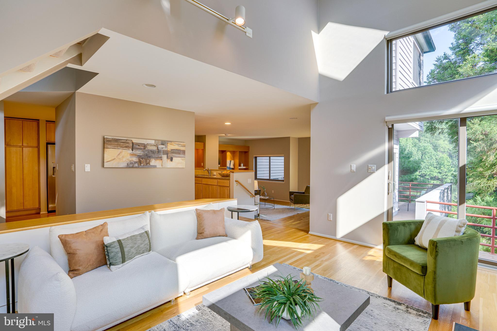 2148 South Bay Lane Reston, VA 20191 - Photo 12 of 73 a living room with furniture and a large window