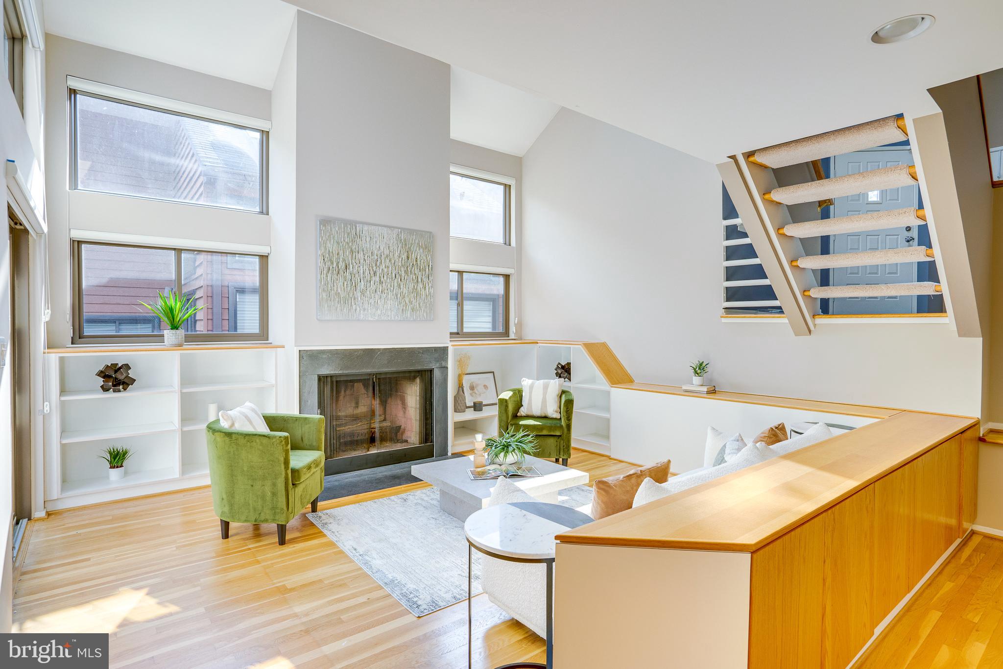 2148 South Bay Lane Reston, VA 20191 - Photo 14 of 73 a living room with furniture and a fireplace