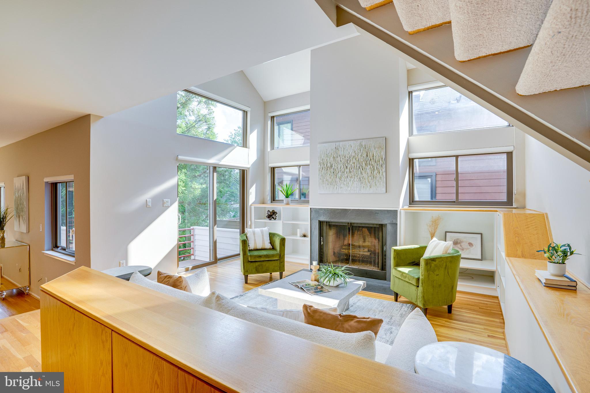 2148 South Bay Lane Reston, VA 20191 - Photo 15 of 73 a living room with fireplace furniture and a large window