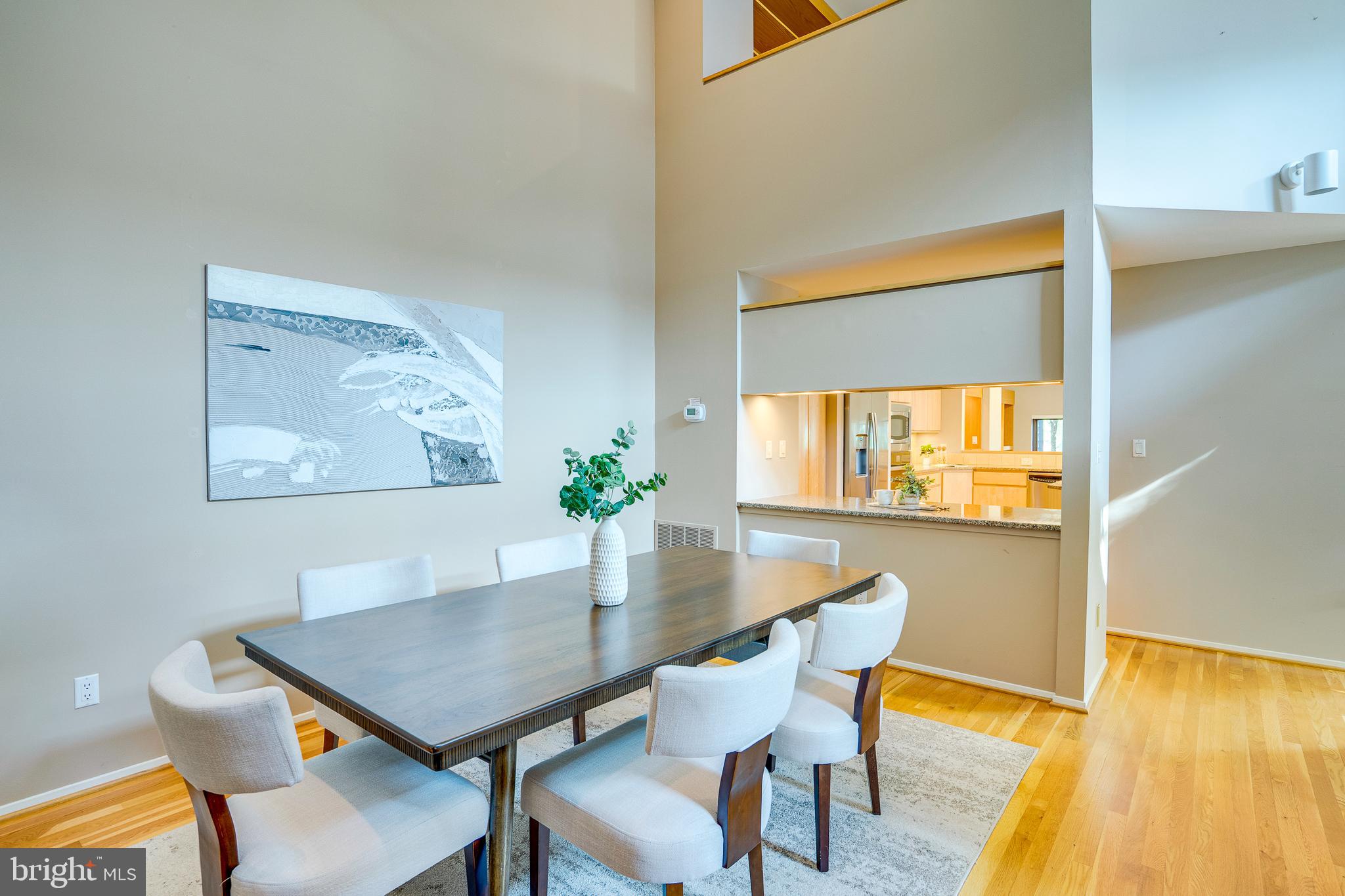 2148 South Bay Lane Reston, VA 20191 - Photo 18 of 73 a view of a dining room with furniture and wooden floor