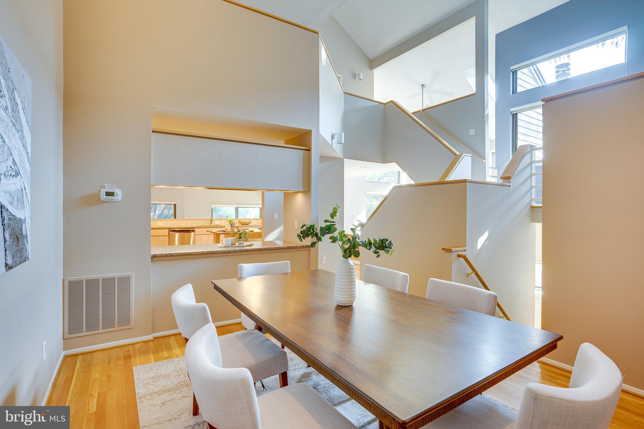 2148 South Bay Lane Reston, VA 20191 - Photo 19 of 73 a view of kitchen and dining room with wooden floor