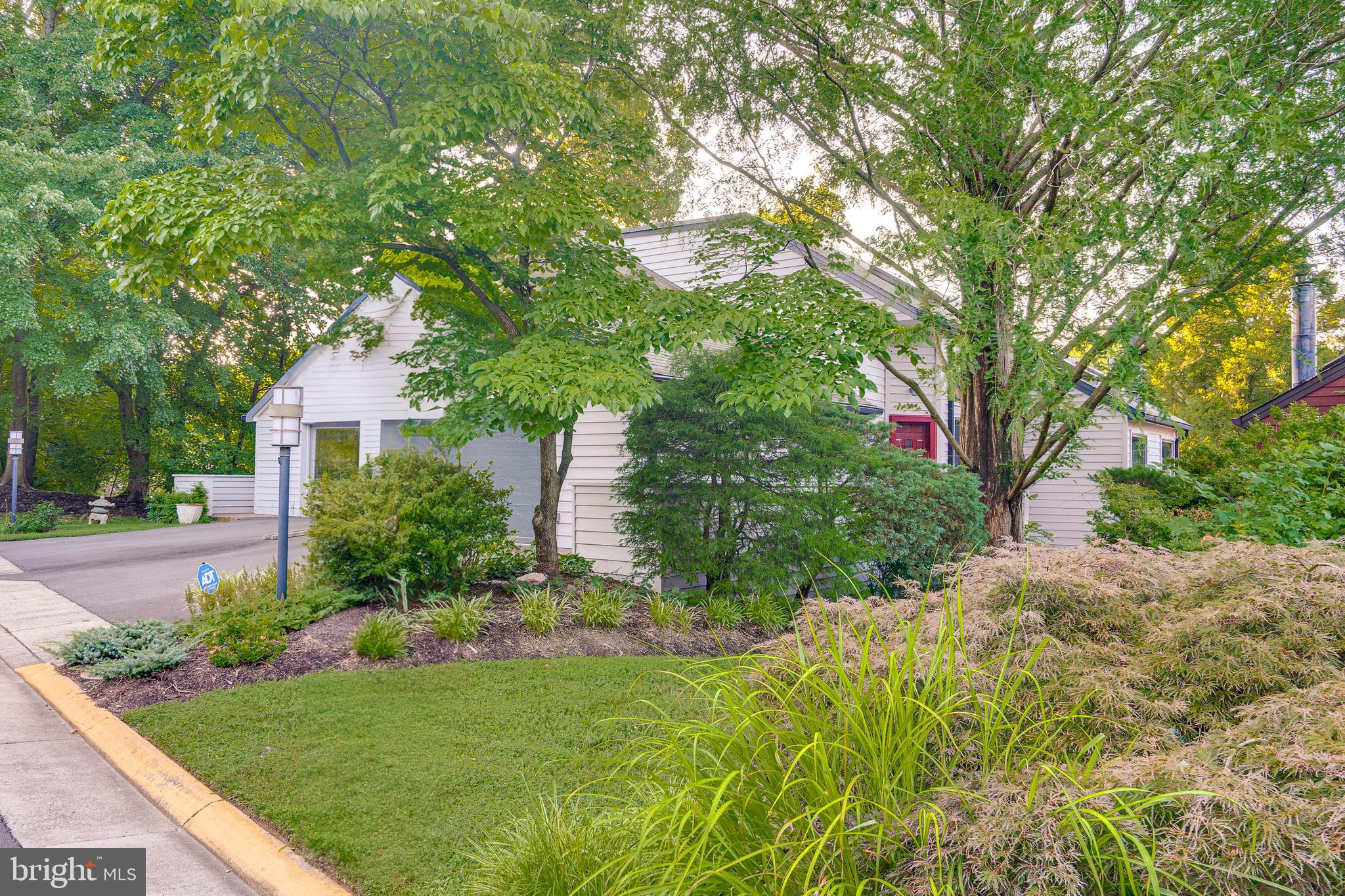 2148 South Bay Lane Reston, VA 20191 - Photo 2 of 73 a front view of a house with garden