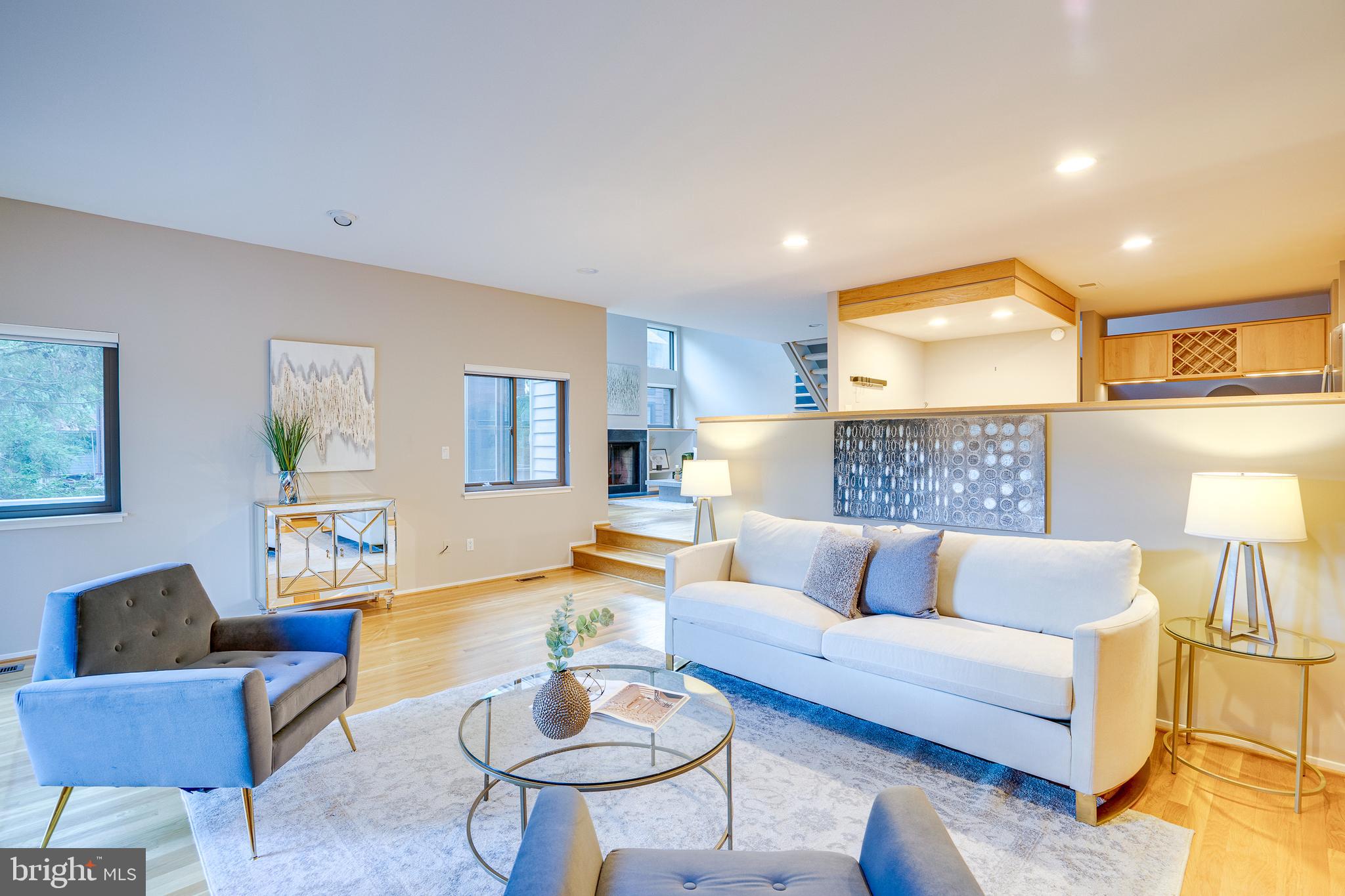 2148 South Bay Lane Reston, VA 20191 - Photo 23 of 73 a living room with furniture and a lamp