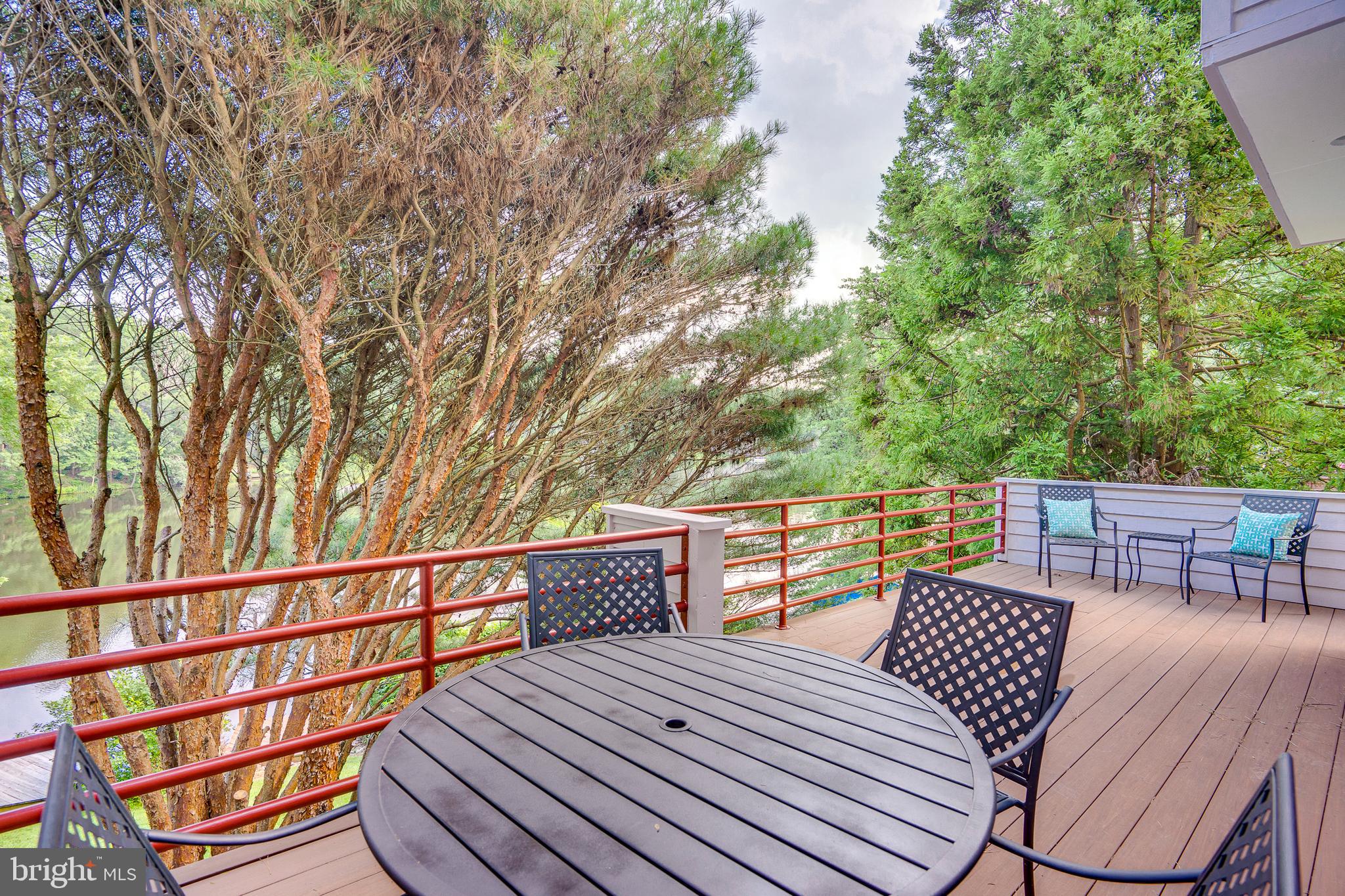 2148 South Bay Lane Reston, VA 20191 - Photo 29 of 73 a view of balcony with wooden floor and outdoor seating