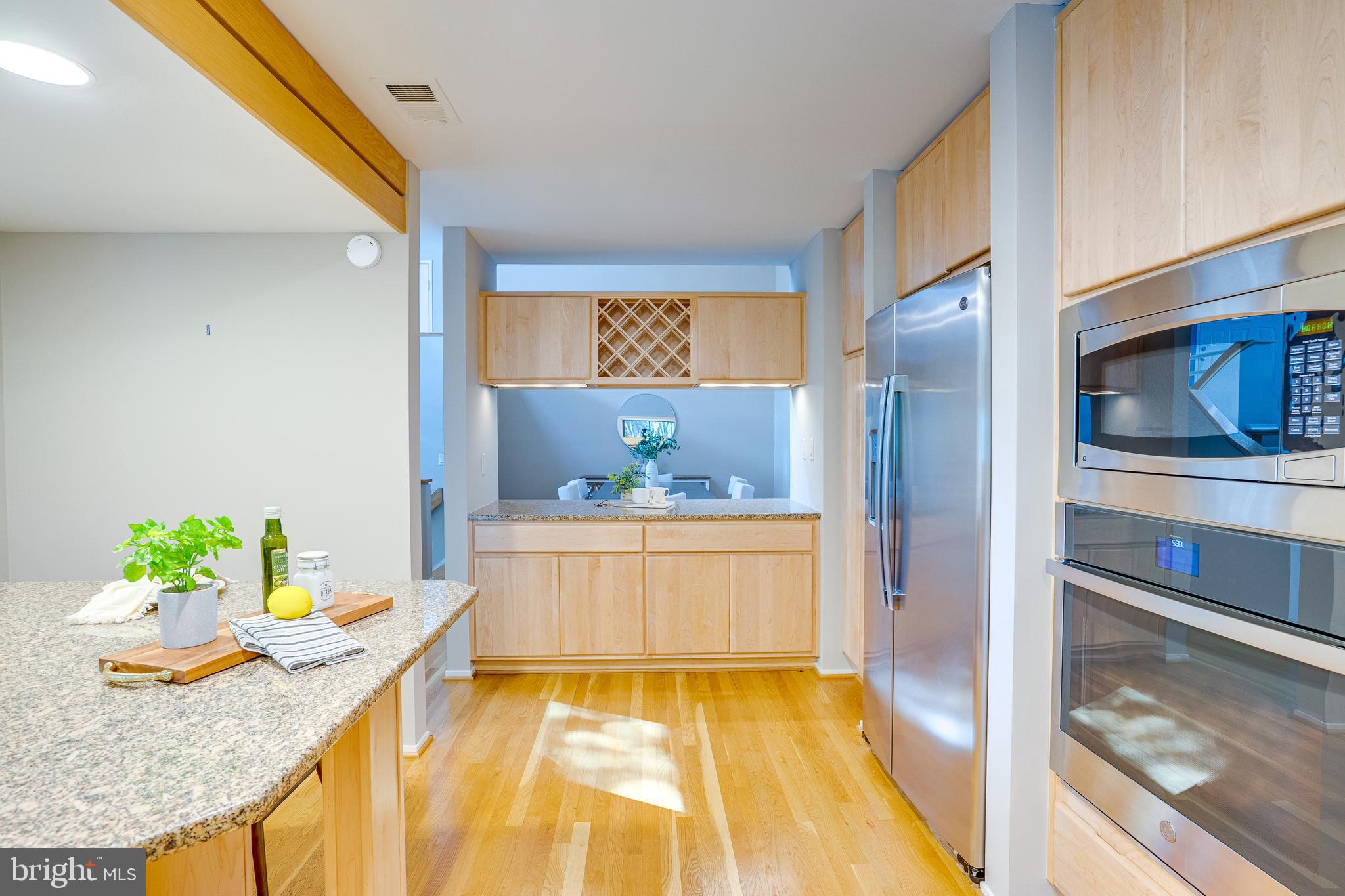 2148 South Bay Lane Reston, VA 20191 - Photo 32 of 73 a living room with stainless steel appliances granite countertop furniture and a kitchen view