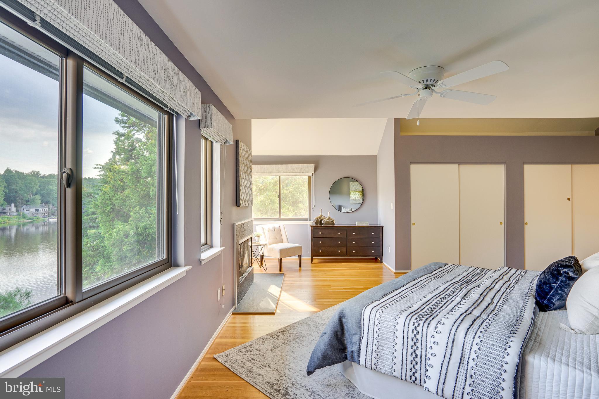 2148 South Bay Lane Reston, VA 20191 - Photo 43 of 73 a bedroom with a large bed and a large window