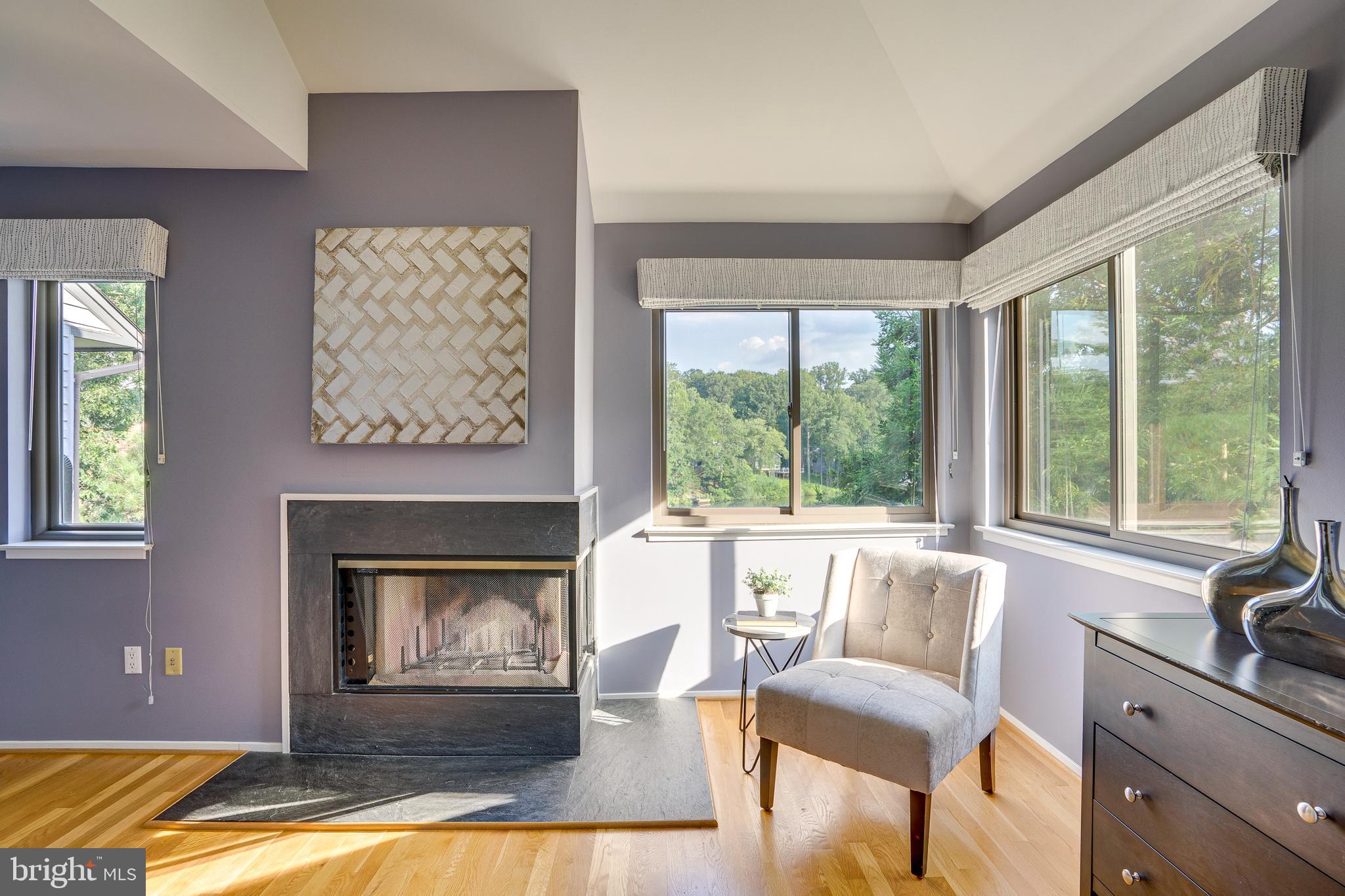 2148 South Bay Lane Reston, VA 20191 - Photo 44 of 73 a living room with furniture and a fireplace
