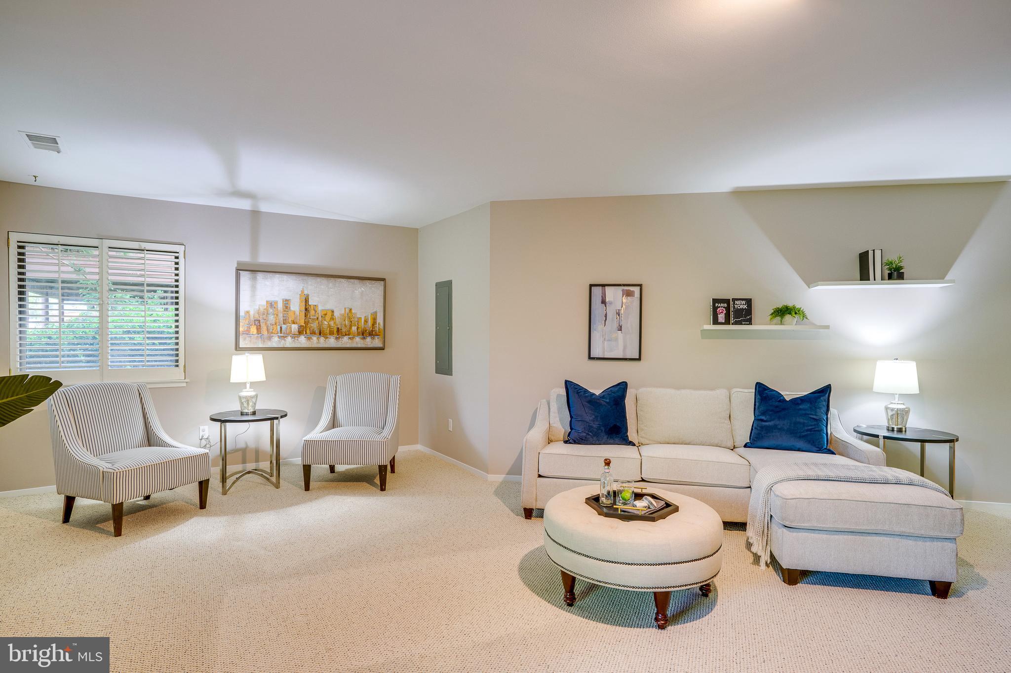 2148 South Bay Lane Reston, VA 20191 - Photo 53 of 73 a living room with furniture and a window