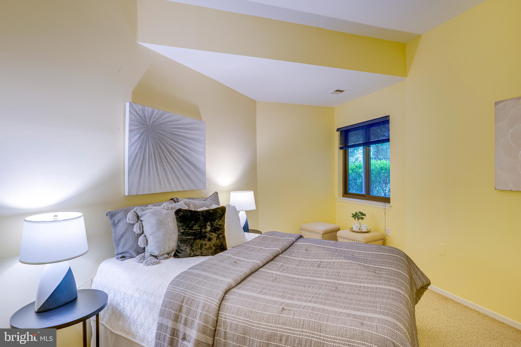 2148 South Bay Lane Reston, VA 20191 - Photo 58 of 73 a bedroom with a bed and a lamp