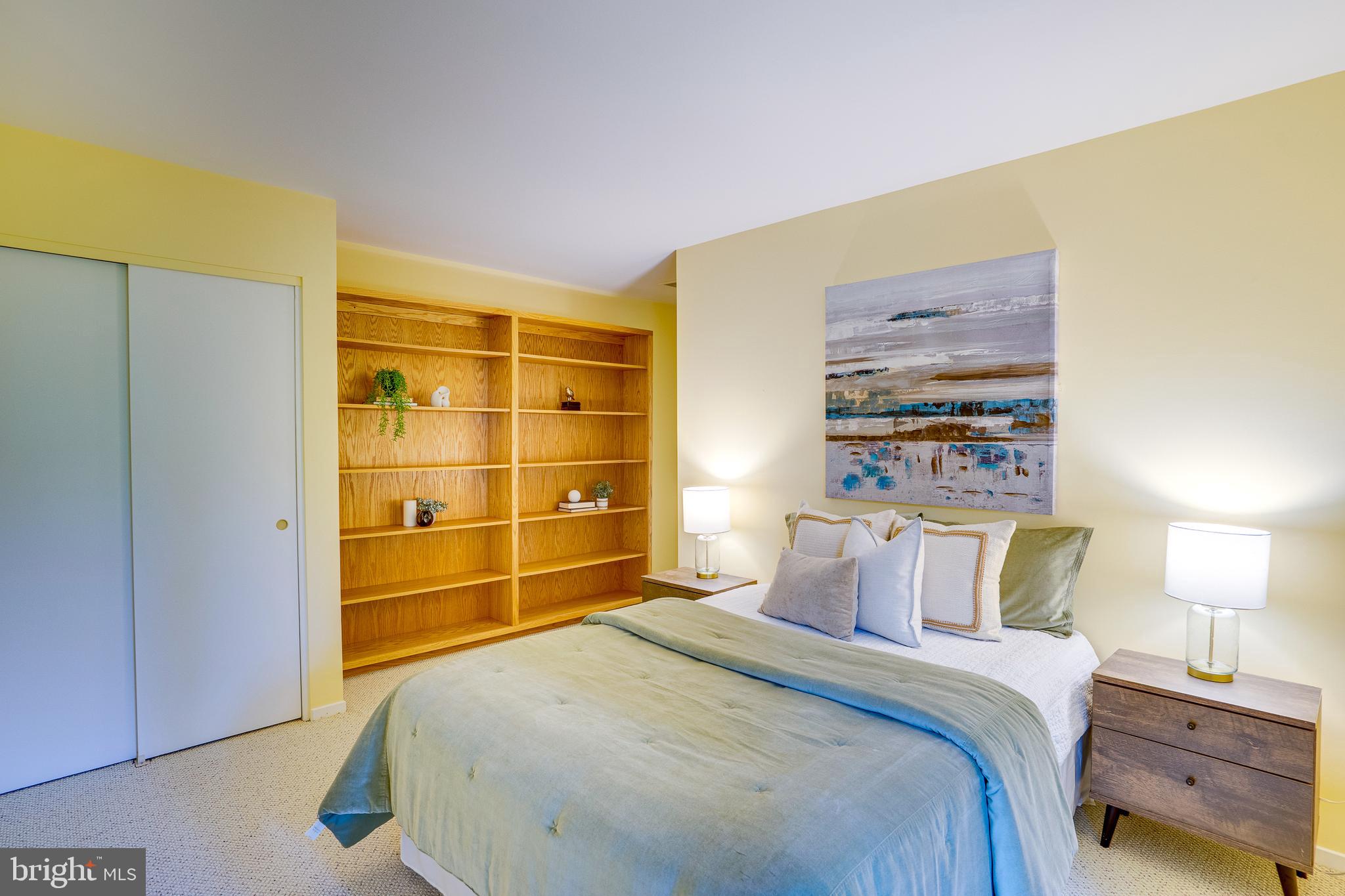 2148 South Bay Lane Reston, VA 20191 - Photo 61 of 73 a bedroom with a bed and a cabinets