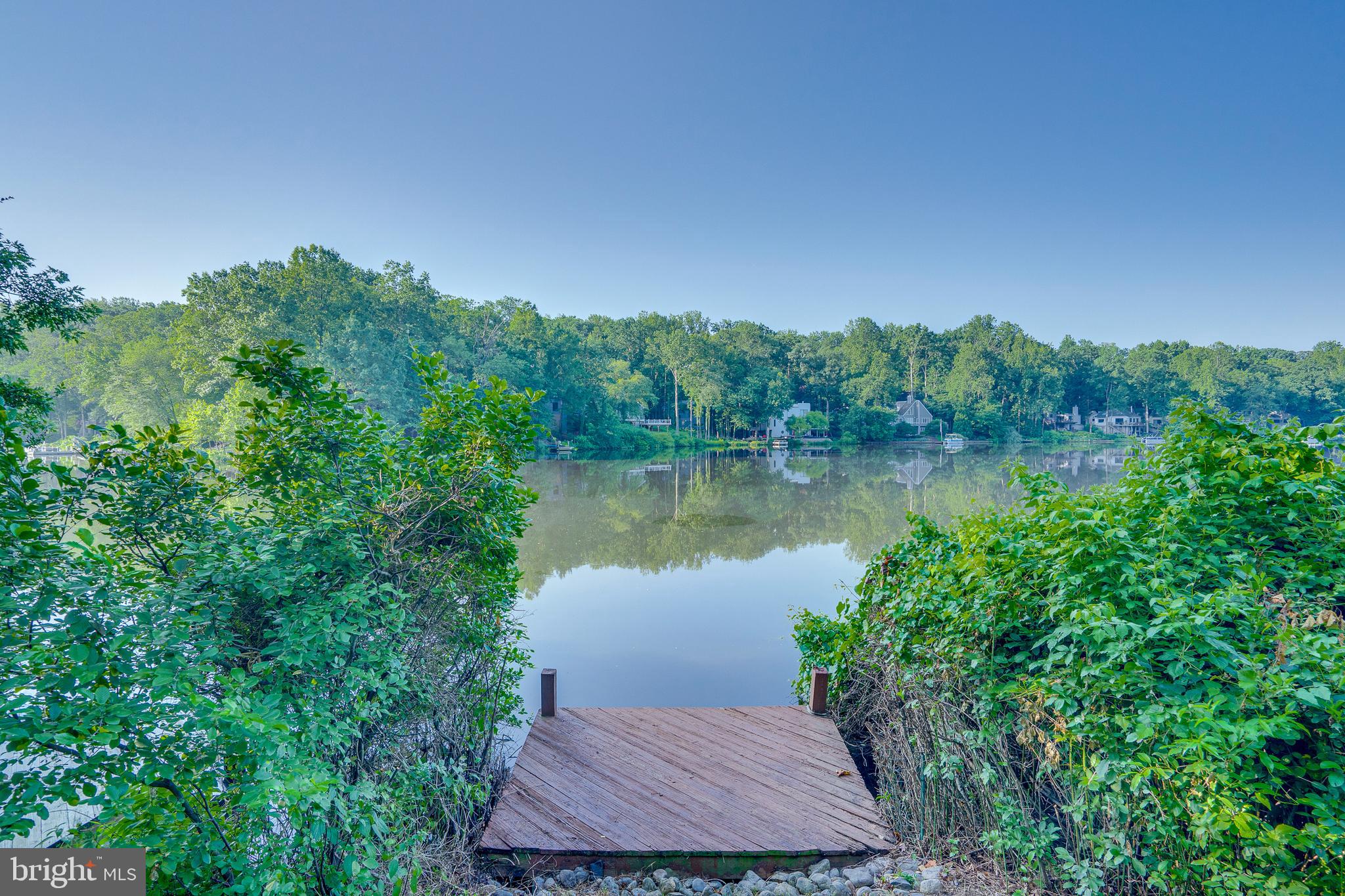 2148 South Bay Lane Reston, VA 20191 - Photo 72 of 73 a view of a lake with a yard and mountain view