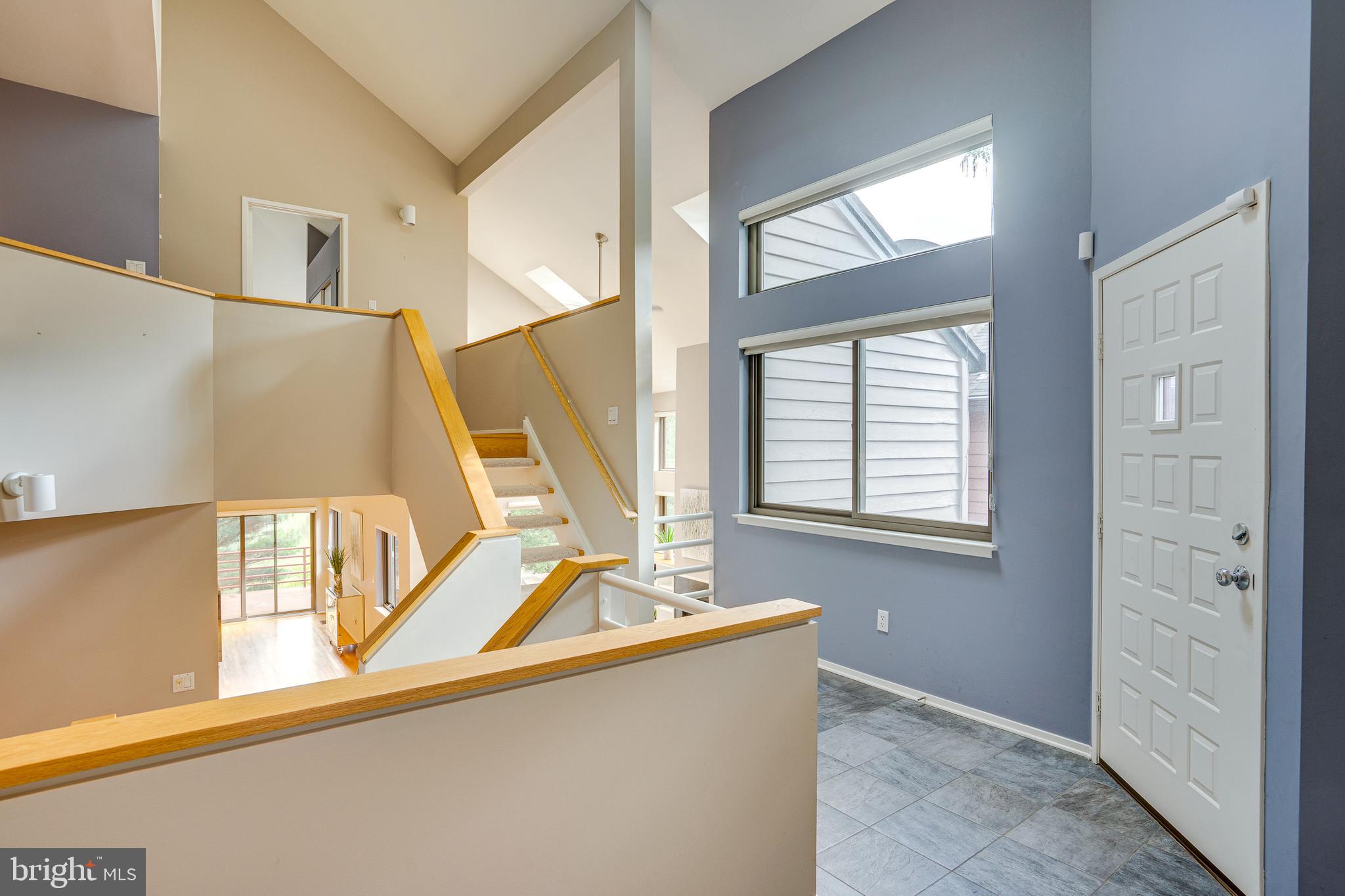2148 South Bay Lane Reston, VA 20191 - Photo 8 of 73 a view of a living room with windows