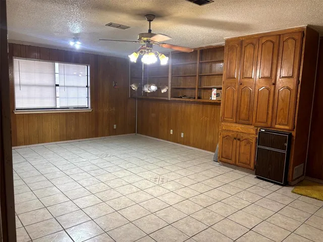 a kitchen with kitchen island cabinets and window