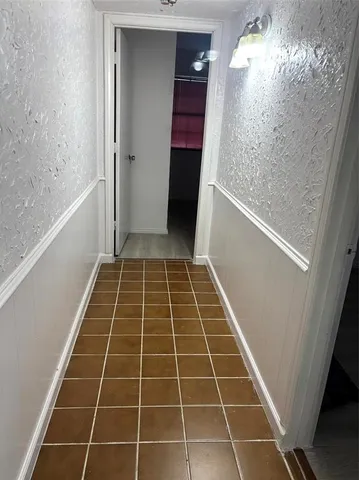 a bathroom with a glass door shower and a sink