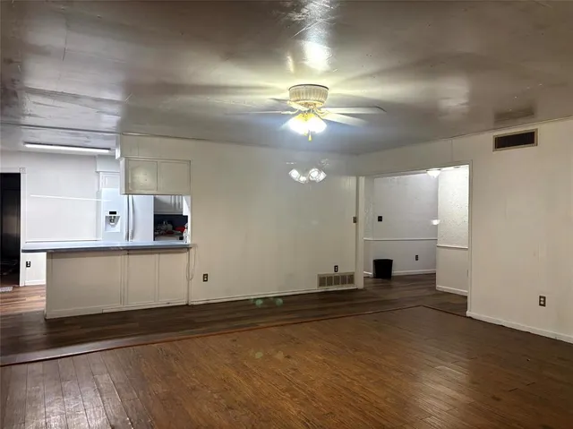 a view of a kitchen with a sink and a stove top oven