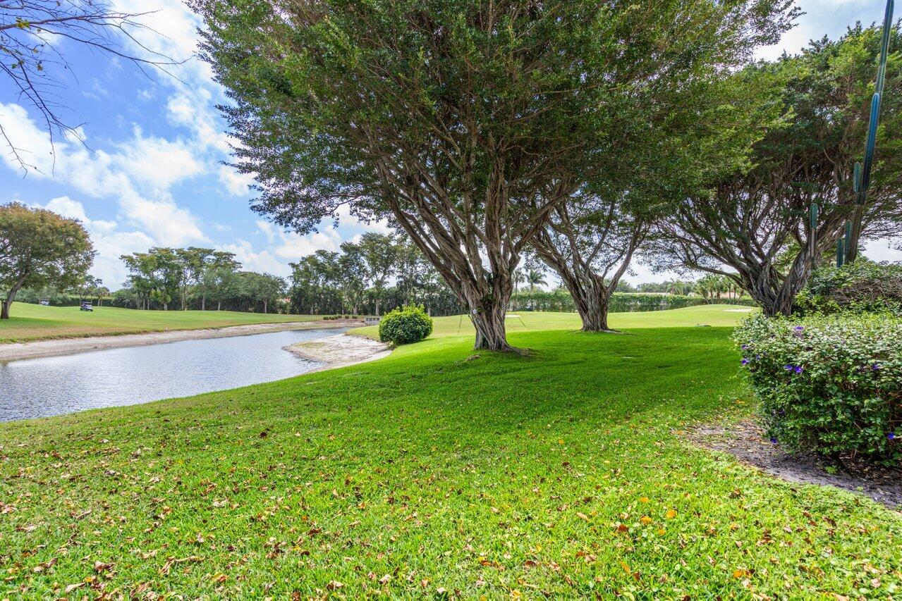 34 Stratford Lane West, Unit C Boynton Beach, FL 33436 - Photo 37 of 38 a view of green field with trees
